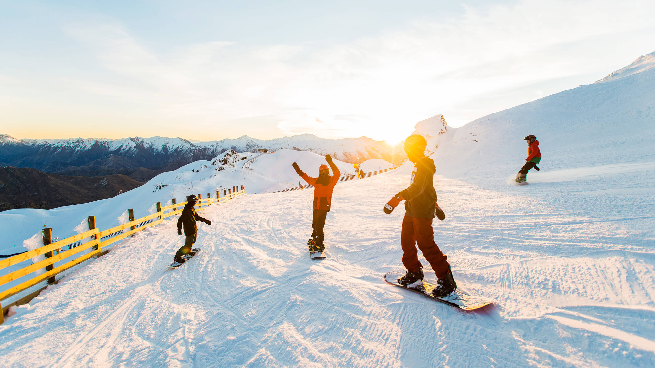 People skiing as the sunsets.